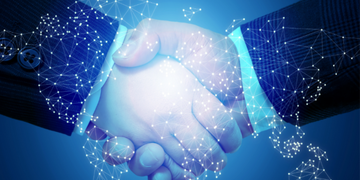 Two hands clasped in a handshake with networking overlay.