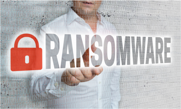 A businessman stands behind a transparent grid while pointing to the word "ransomware."
